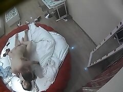 Young Chinese couple having passionate sex