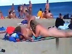 Swingers Having Fun Outdoors At A Beach
