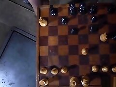 Celled bdsm sub masturbates with chess piece
